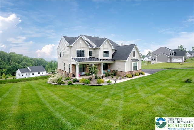 5635 Saucon Ridge Rd, Upper Saucon Twp, PA 18036 - modern inspired farmhouse featuring board and batten siding, a standing seam roof, a porch, and a front yard
