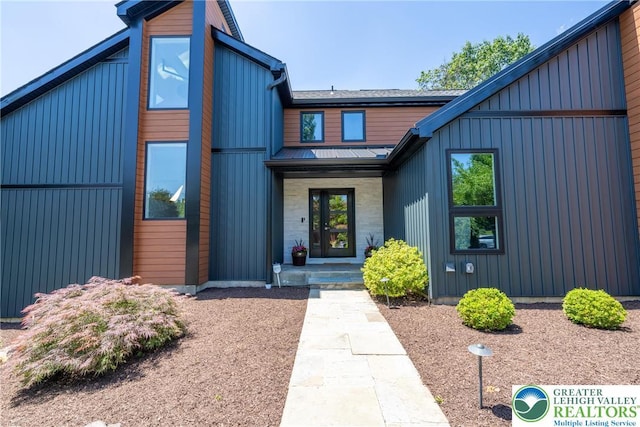 1488 Shelburne Ct, South Whitehall Twp, PA 18104 - view of front facade with board and batten siding and a metal roof
