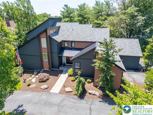 1488 Shelburne Ct, South Whitehall Twp, PA 18104 - view of front of house with roof with shingles, a standing seam roof, and a metal roof