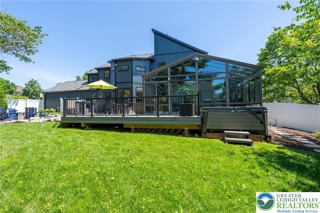 1488 Shelburne Ct, South Whitehall Twp, PA 18104 - rear view of house featuring a wooden deck and a sunroom