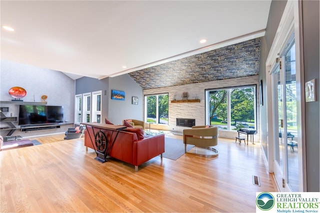 1488 Shelburne Ct, South Whitehall Twp, PA 18104 - living room with light wood-style floors, a fireplace, vaulted ceiling, and recessed lighting