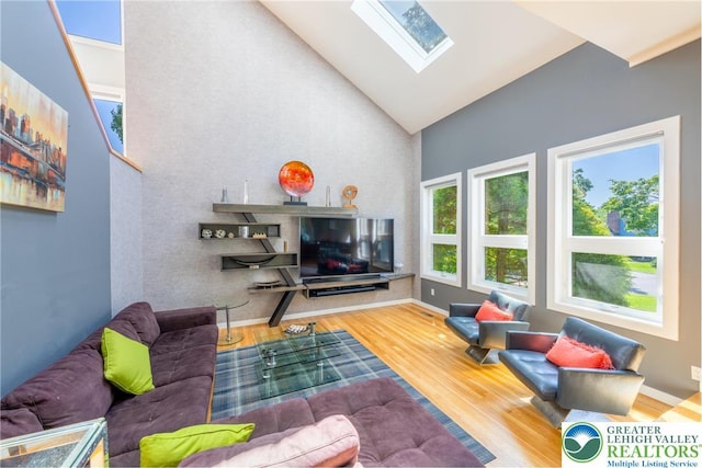 1488 Shelburne Ct, South Whitehall Twp, PA 18104 - living room featuring a skylight, high vaulted ceiling, and wood finished floors