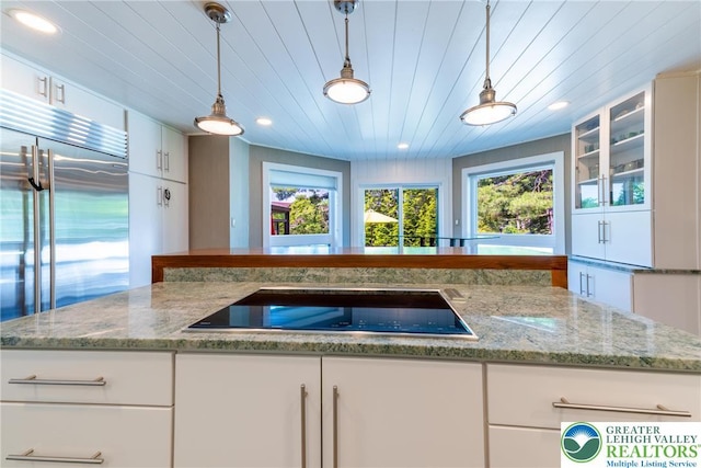 1488 Shelburne Ct, South Whitehall Twp, PA 18104 - kitchen with black electric cooktop, healthy amount of natural light, white cabinetry, recessed lighting, and wooden ceiling