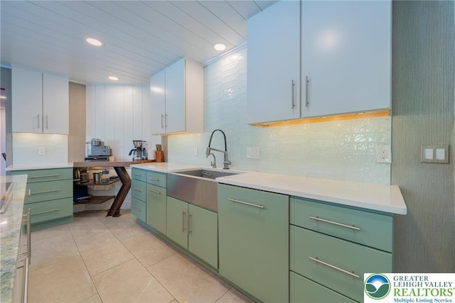 1488 Shelburne Ct, South Whitehall Twp, PA 18104 - kitchen featuring green cabinetry, light countertops, light tile patterned floors, tasteful backsplash, and recessed lighting