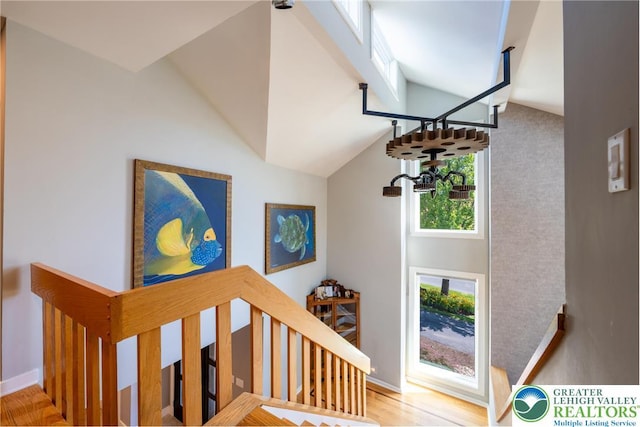 1488 Shelburne Ct, South Whitehall Twp, PA 18104 - staircase featuring vaulted ceiling and wood finished floors