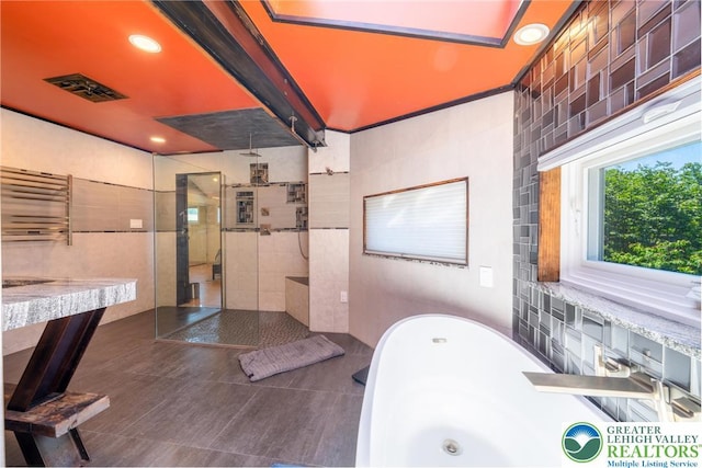 1488 Shelburne Ct, South Whitehall Twp, PA 18104 - full bathroom with a soaking tub, a walk in shower, tile patterned flooring, a towel warmer, and recessed lighting