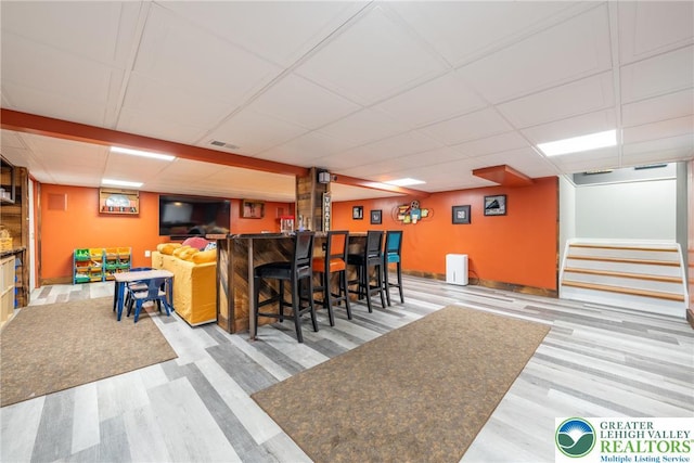 1488 Shelburne Ct, South Whitehall Twp, PA 18104 - indoor dry bar with a drop ceiling, wood finished floors, and stairs