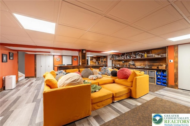 1488 Shelburne Ct, South Whitehall Twp, PA 18104 - living area with wood finished floors, a bar, stairway, and a paneled ceiling