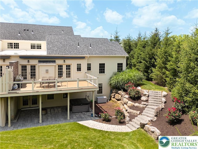 2063 Forge Run, Bethlehem City, PA 18015 - rear view of property featuring french doors, a jacuzzi, a patio area, a shingled roof, and a lawn