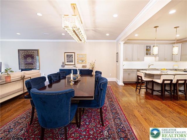 2063 Forge Run, Bethlehem City, PA 18015 - dining space featuring recessed lighting, dark wood-style floors, crown molding, and ornate columns