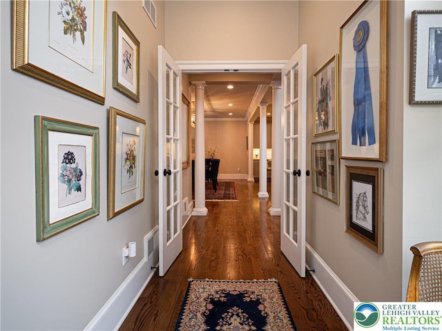 2063 Forge Run, Bethlehem City, PA 18015 - hall featuring french doors, decorative columns, dark wood-style floors, and ornamental molding