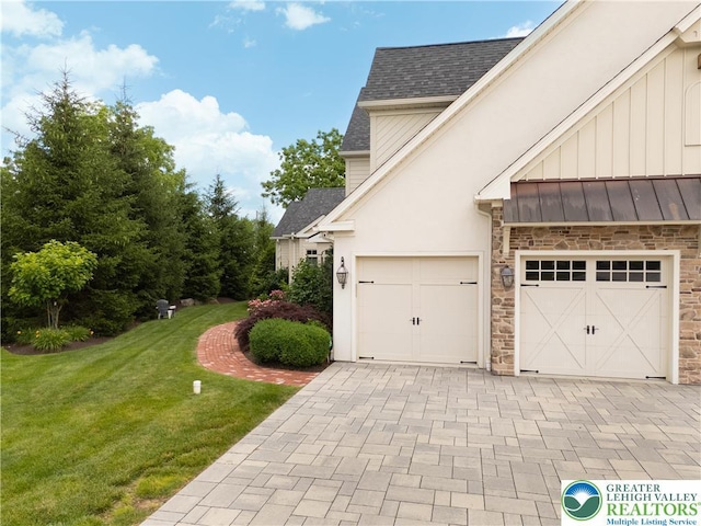 2063 Forge Run, Bethlehem City, PA 18015 - view of home's exterior with a shingled roof, stone siding, a lawn, and decorative driveway