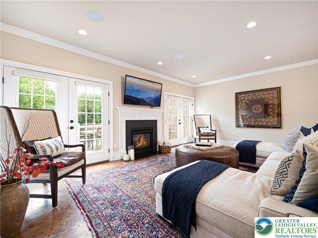 2063 Forge Run, Bethlehem City, PA 18015 - living area with french doors, wood finished floors, ornamental molding, recessed lighting, and a fireplace with flush hearth