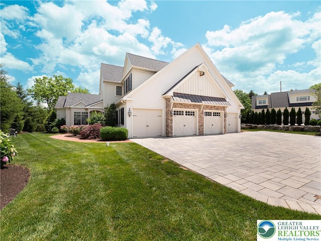 2063 Forge Run, Bethlehem City, PA 18015 - view of side of property featuring decorative driveway, a yard, an attached garage, a standing seam roof, and roof with shingles