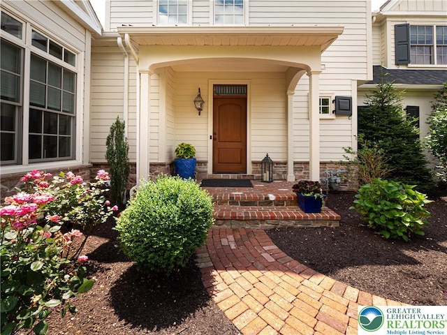 2063 Forge Run, Bethlehem City, PA 18015 - property entrance featuring a porch and stone siding