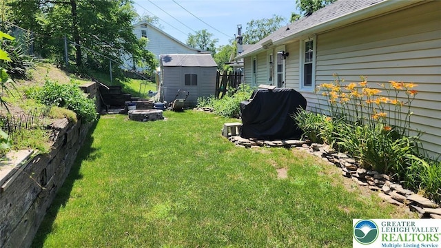 3807 Teak Dr, Lehigh Twp, PA 18067 - view of yard with an outdoor fire pit and a shed