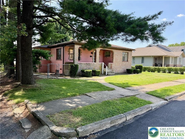 1818 W Jane St, South Whitehall Twp, PA 18104 - single story home with a porch and stone siding