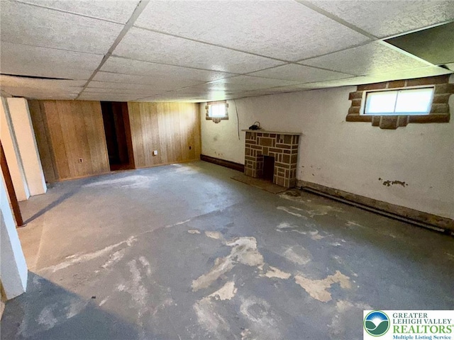 1818 W Jane St, South Whitehall Twp, PA 18104 - below grade area with a paneled ceiling, wood walls, and healthy amount of natural light