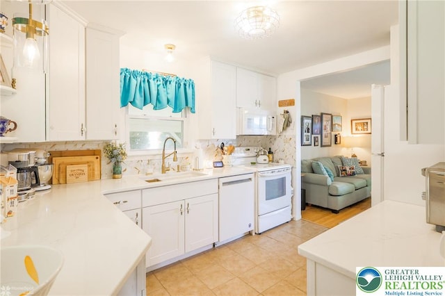 4306 Emerick Ter, Easton, PA 18045 - kitchen featuring white appliances, backsplash, white cabinetry, and light countertops