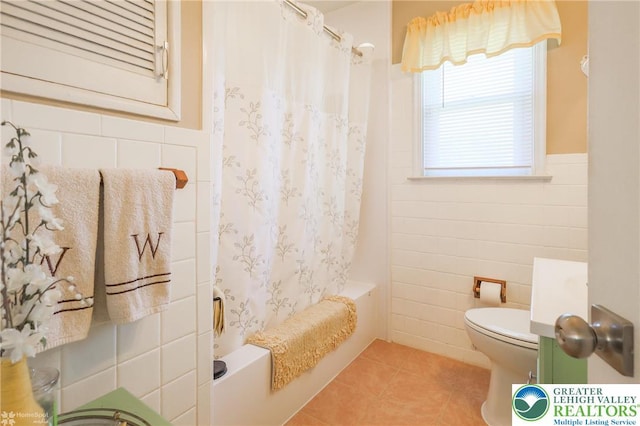 4306 Emerick Ter, Easton, PA 18045 - bathroom featuring tile walls, tile patterned floors, shower / bath combo, a wainscoted wall, and vanity