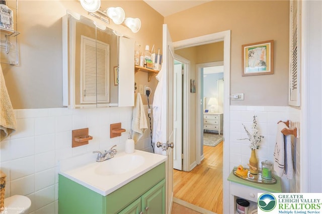 4306 Emerick Ter, Easton, PA 18045 - bathroom featuring tile walls, vanity, and wood finished floors