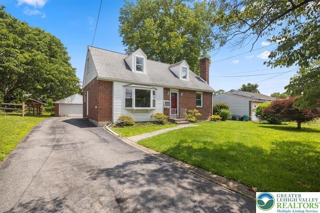803 Stones Crossing Rd, Palmer Twp, PA 18045 - cape cod home featuring brick siding, an outbuilding, a front lawn, a garage, and a chimney