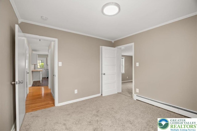 803 Stones Crossing Rd, Palmer Twp, PA 18045 - unfurnished bedroom with a baseboard heating unit, carpet floors, and ornamental molding