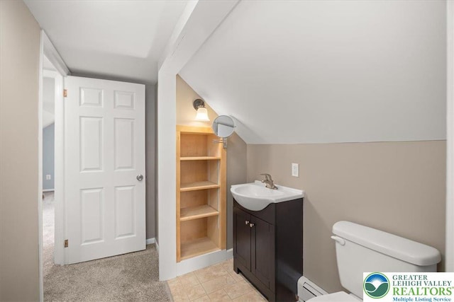 803 Stones Crossing Rd, Palmer Twp, PA 18045 - bathroom featuring vanity, baseboard heating, and vaulted ceiling