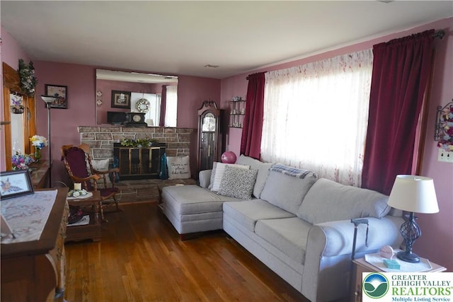 871 2nd St, Whitehall Twp, PA 18052 - living room featuring plenty of natural light, wood finished floors, and a stone fireplace