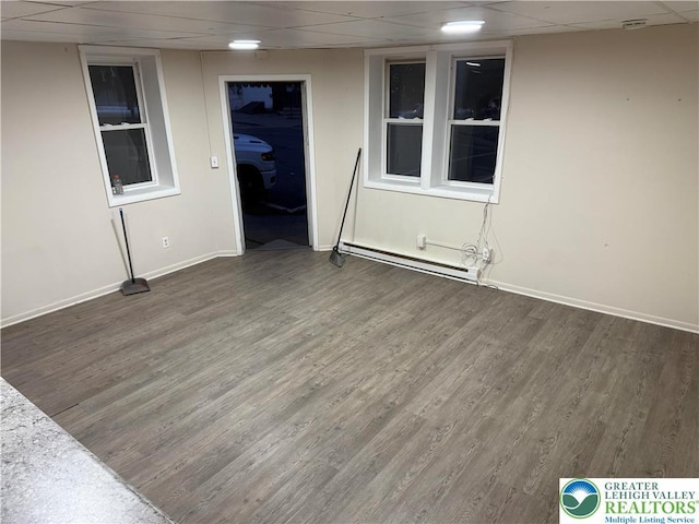 539 Atlantic Unit 3, Bethlehem Twp, PA 18015 - empty room with a baseboard radiator, wood finished floors, and a drop ceiling