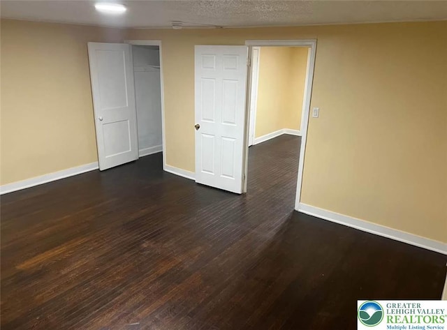 539 Atlantic Unit 3, Bethlehem Twp, PA 18015 - basement featuring dark wood-type flooring and baseboards