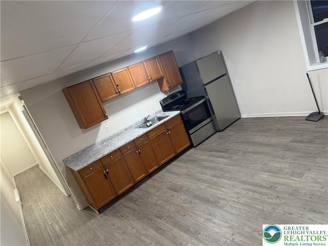 539 Atlantic Unit 3, Bethlehem Twp, PA 18015 - kitchen featuring electric range, brown cabinetry, and light wood-style flooring