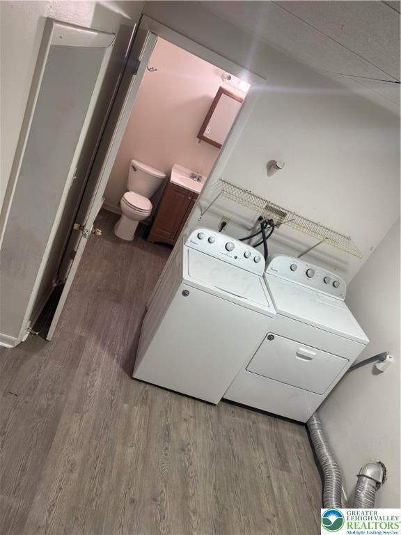 539 Atlantic Unit 3, Bethlehem Twp, PA 18015 - laundry area with wood finished floors and washer and dryer