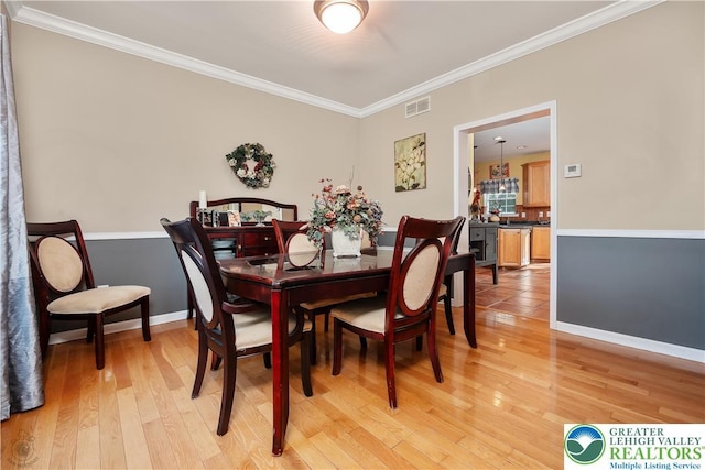1989 Strathmore Dr, Macungie Boro, PA 18062 - dining room with crown molding and light wood-type flooring