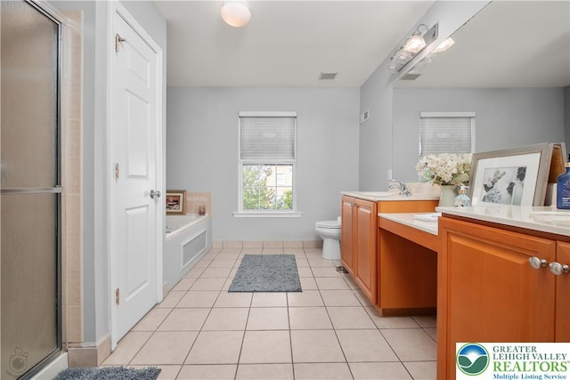 1989 Strathmore Dr, Macungie Boro, PA 18062 - full bathroom with vanity, a stall shower, tile patterned flooring, and a garden tub
