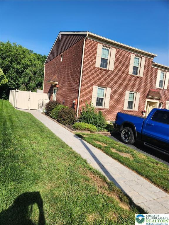1443 Robert St, Whitehall Twp, PA 18052 - view of property exterior featuring a gate and brick siding
