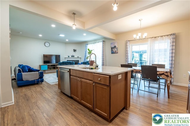 320 Bendelow Ln, Northampton Boro, PA 18067 - kitchen with stainless steel dishwasher, brown cabinets, wood finished floors, a chandelier, and open floor plan