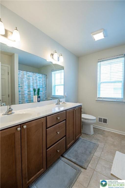 320 Bendelow Ln, Northampton Boro, PA 18067 - full bathroom with double vanity, tile patterned floors, and curtained shower