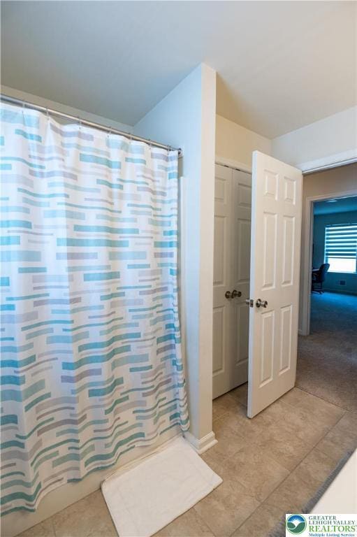320 Bendelow Ln, Northampton Boro, PA 18067 - bathroom featuring tile patterned flooring and a shower with curtain
