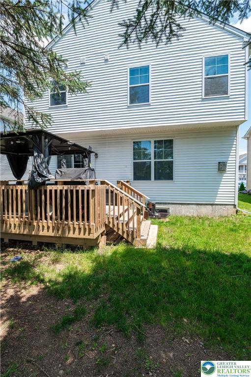 320 Bendelow Ln, Northampton Boro, PA 18067 - back of property with a wooden deck and a yard