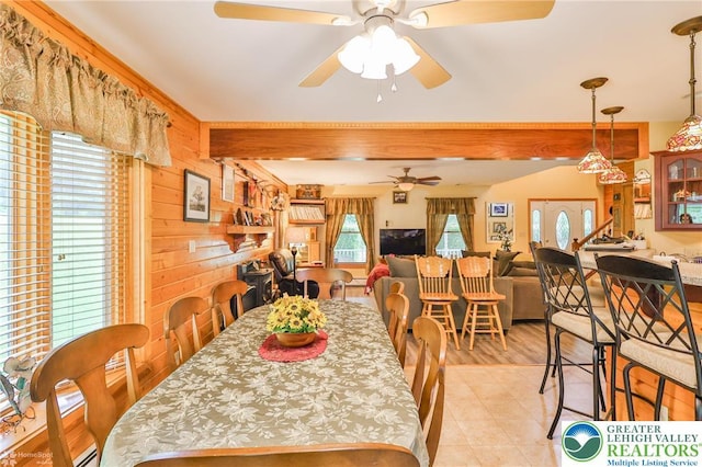 142 Hickory Ln, Chestnuthill Twp, PA 18353 - dining space with a ceiling fan and wooden walls