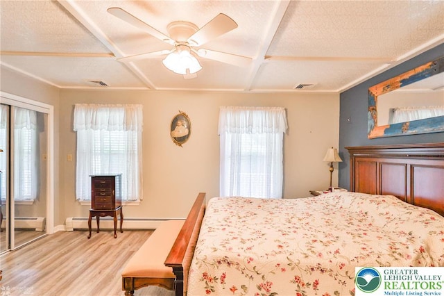 142 Hickory Ln, Chestnuthill Twp, PA 18353 - bedroom with coffered ceiling, wood finished floors, baseboard heating, and a ceiling fan