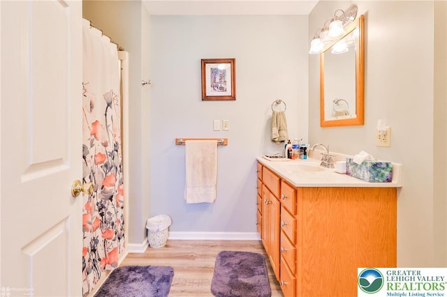 142 Hickory Ln, Chestnuthill Twp, PA 18353 - full bath with vanity, wood finished floors, and curtained shower