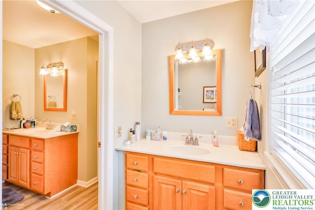 142 Hickory Ln, Chestnuthill Twp, PA 18353 - bathroom featuring vanity, wood finished floors, and a chandelier