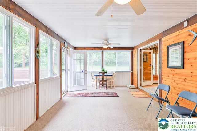 142 Hickory Ln, Chestnuthill Twp, PA 18353 - unfurnished sunroom with ceiling fan, carpet flooring, healthy amount of natural light, and wood walls