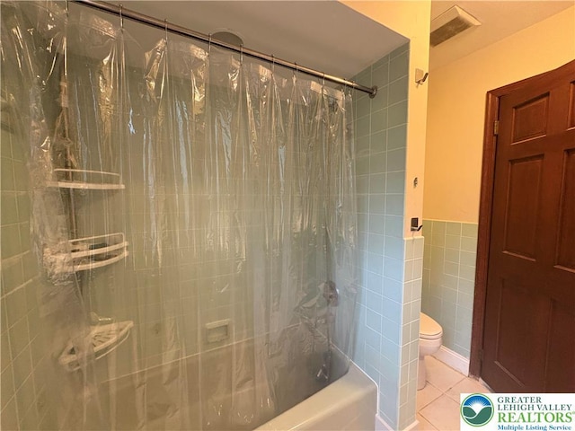 4804 Parkview Dr S, Lower Macungie Twp, PA 18049 - bathroom with tile walls, shower / bath combo with shower curtain, tile patterned floors, and a wainscoted wall