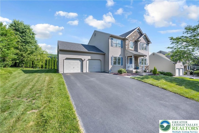 2130 Eagles Landing Dr, Upper Nazareth Twp, PA 18064 - view of front of house with an attached garage, driveway, and a front yard