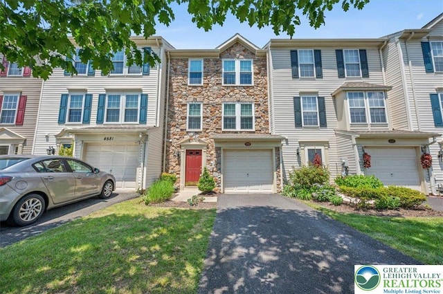 4583 Jasmine Dr, Upper Saucon Twp, PA 18034 - multi unit property featuring driveway, stone siding, and a garage