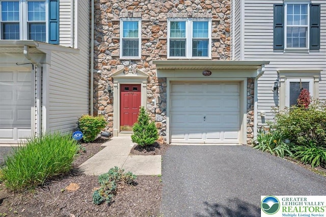 4583 Jasmine Dr, Upper Saucon Twp, PA 18034 - doorway to property featuring stone siding and a garage