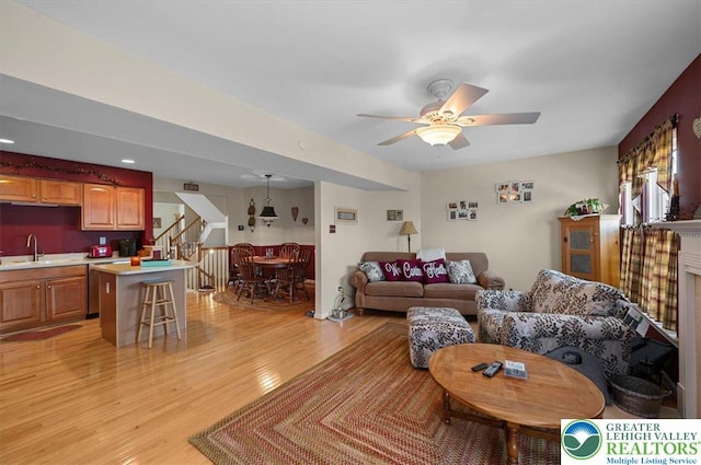 4583 Jasmine Dr, Upper Saucon Twp, PA 18034 - living area with stairs, light wood-type flooring, and ceiling fan